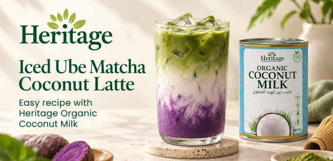 Iced Ube Matcha Coconut Latte with purple ube, creamy coconut milk and green matcha layers beside Heritage Organic Coconut Milk